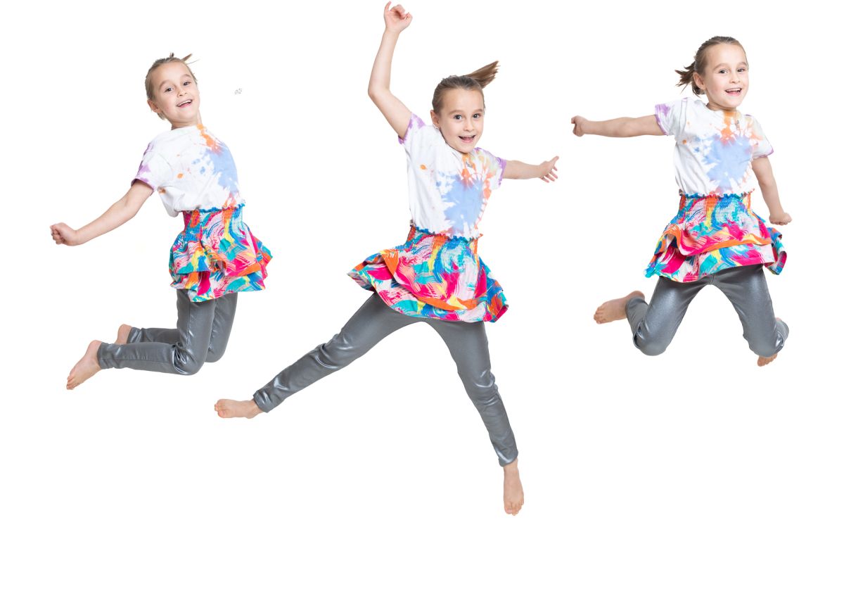 a composite image of a little girl jumping into the air