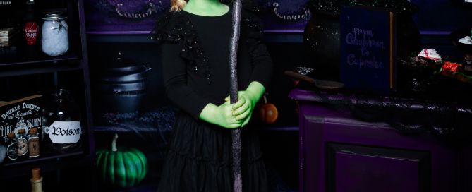 a little girl dressed as Elphaba at a halloween photo shoot in west sussex