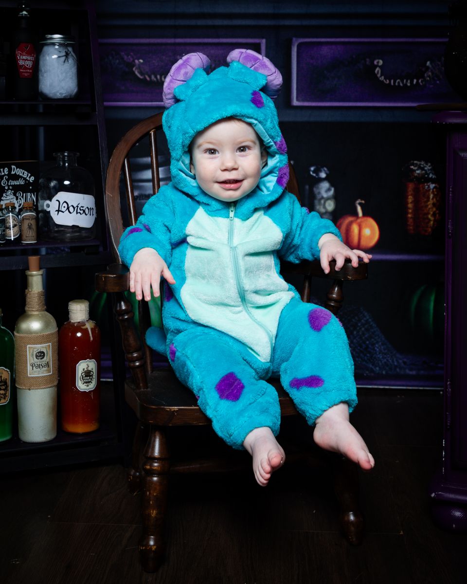 a little boy dressed as Sully at a halloween photo shoot in west sussex