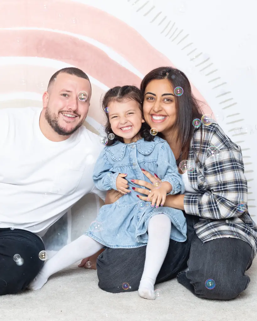 Family Portrait Photo Shoot East Grinstead West Sussex A family pose in the studio for a bubble photo recreation