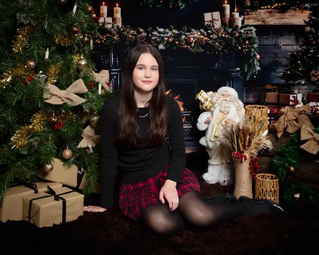 a teenager at a christmas photo shoot