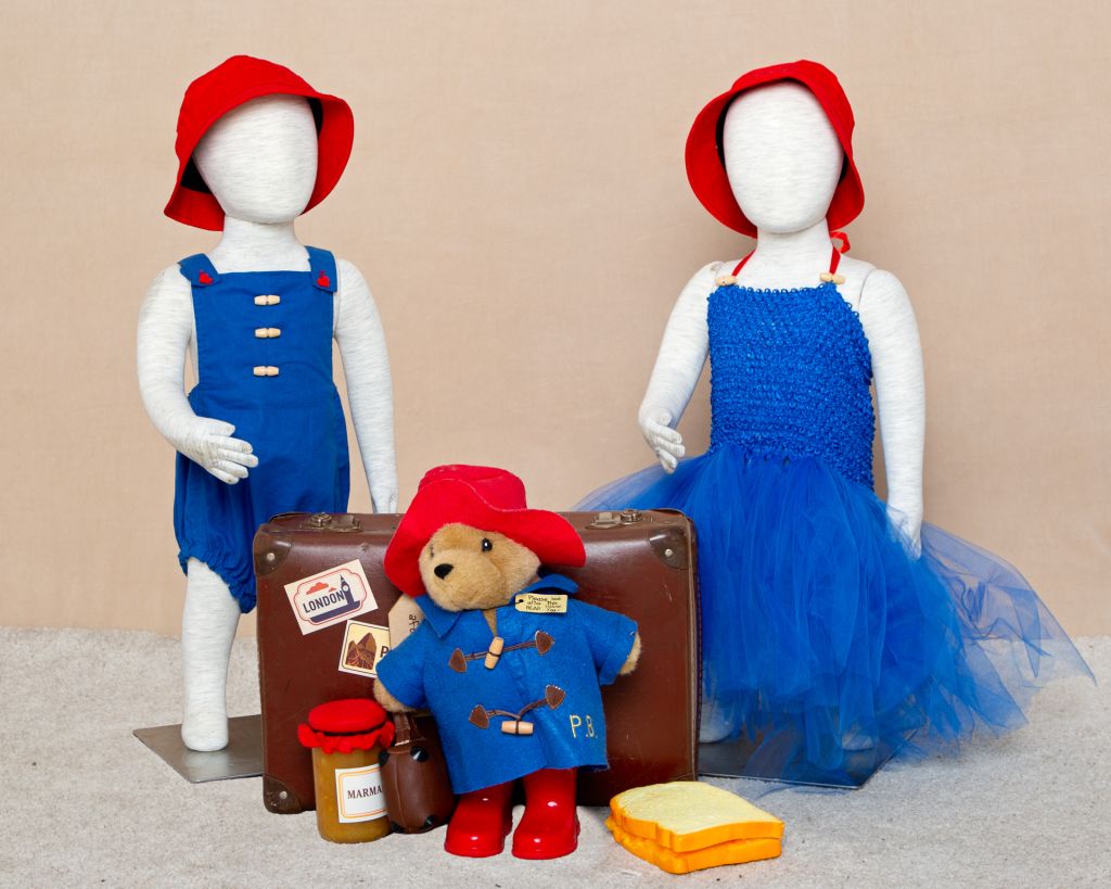 A Paddington accessory set in the studio with matching boy and girl outfits