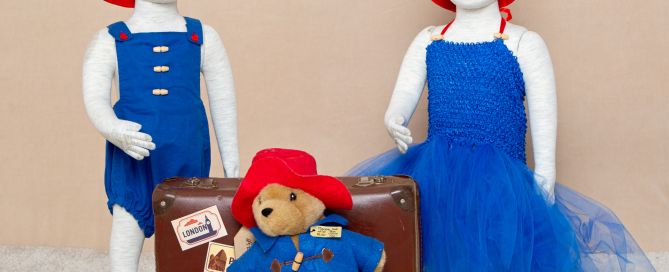 A Paddington accessory set in the studio with matching boy and girl outfits