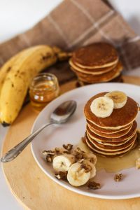 a stack of pancakes and bananas