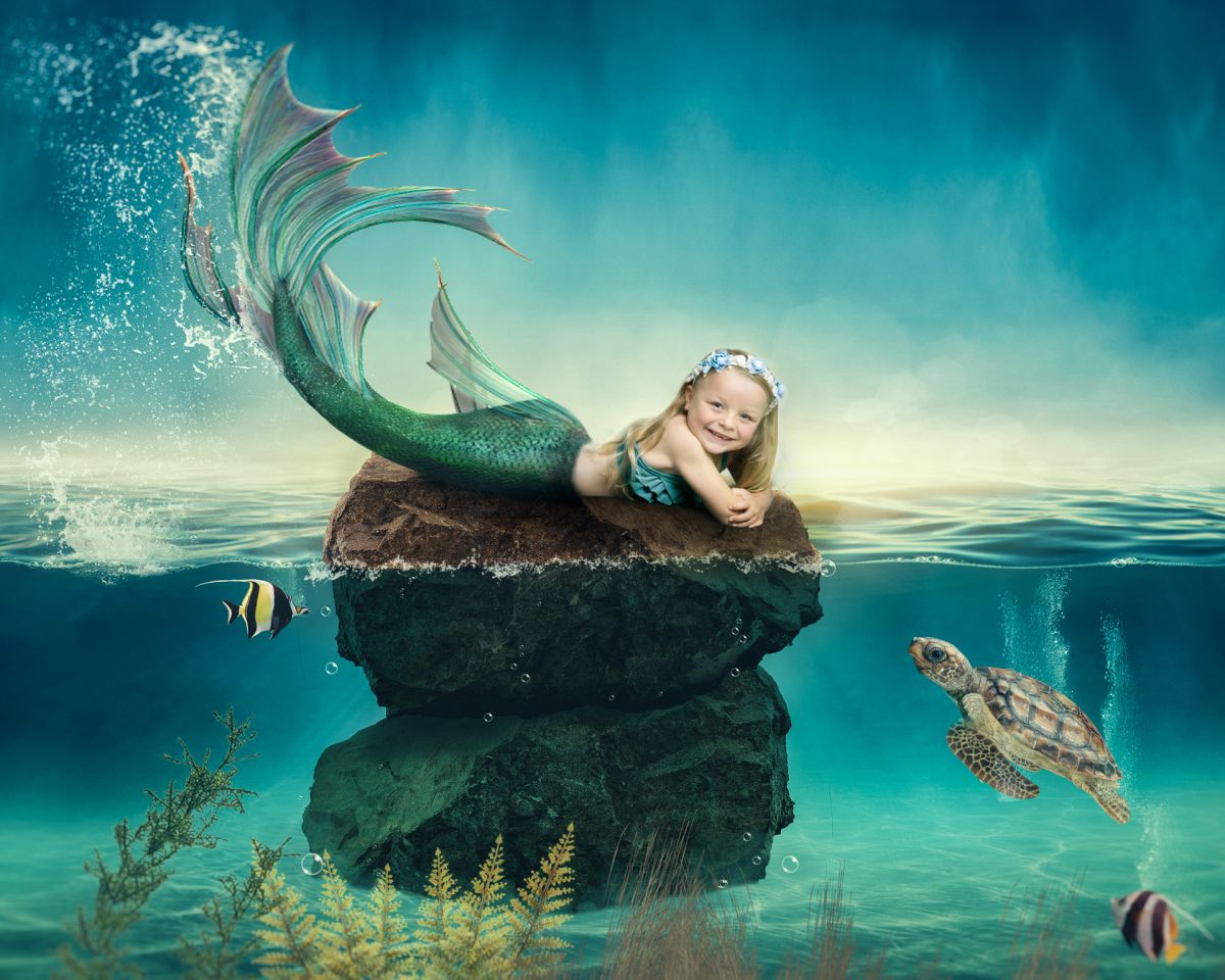 a digital image of a little girl transformed into a mermaid