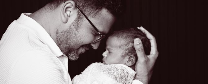 a newborn and dad nose to nose in portrait photo shoot