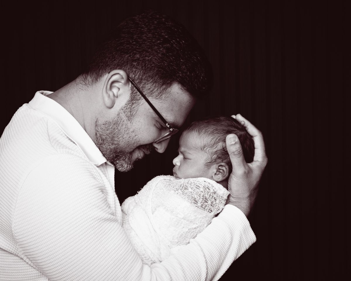 a newborn and dad nose to nose in portrait photo shoot