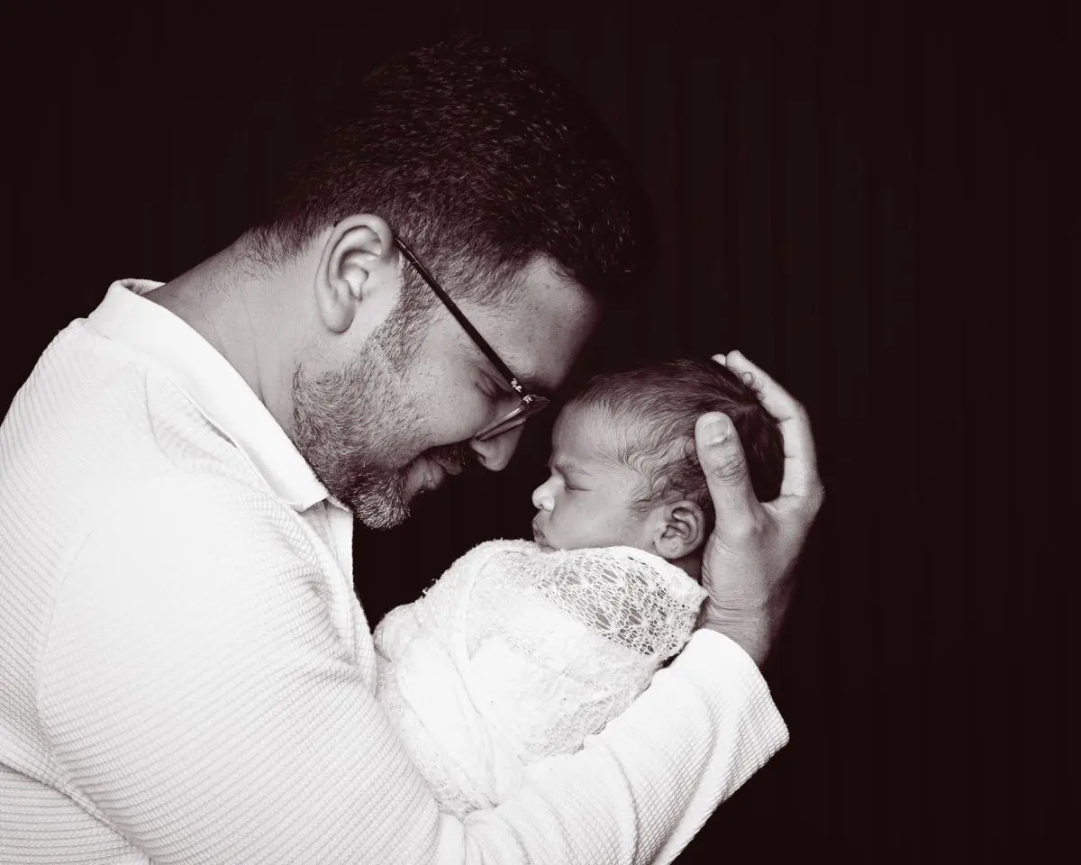 a newborn and dad nose to nose in portrait photo shoot