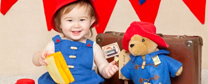 a little girl dressed up as paddington at a photo shoot