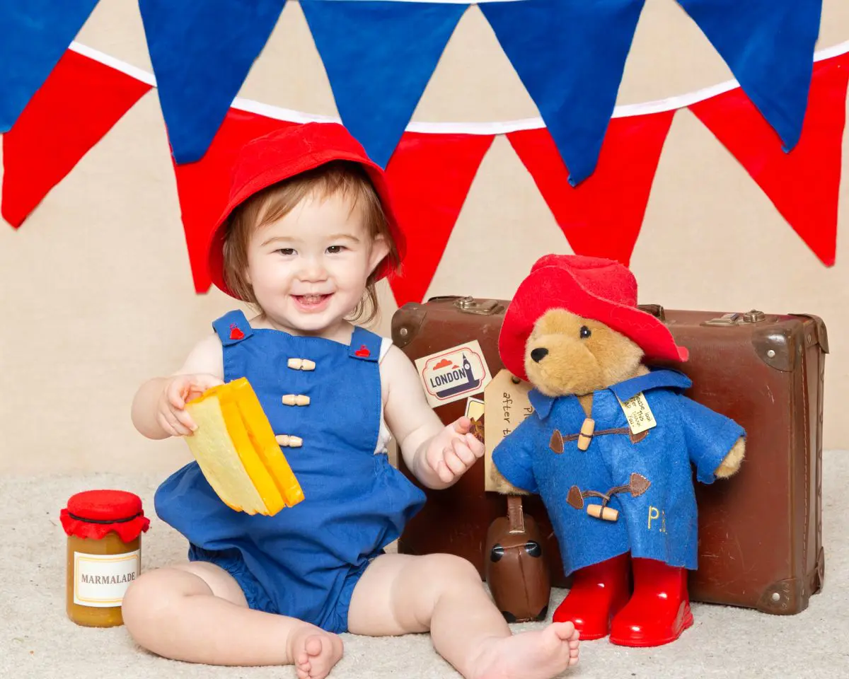 a little girl dressed up as paddington at a photo shoot